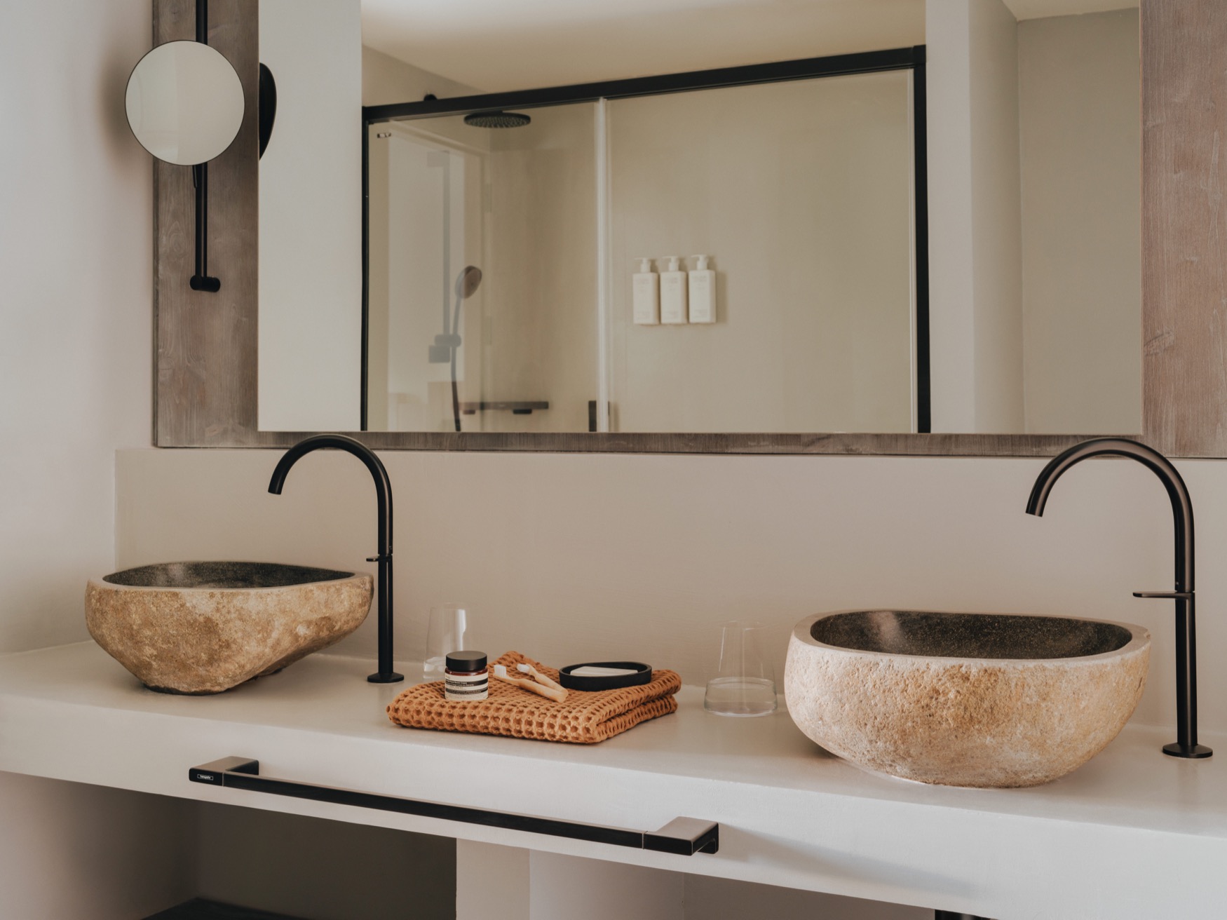 A bathroom showing 2 sinks and a large mirror above them