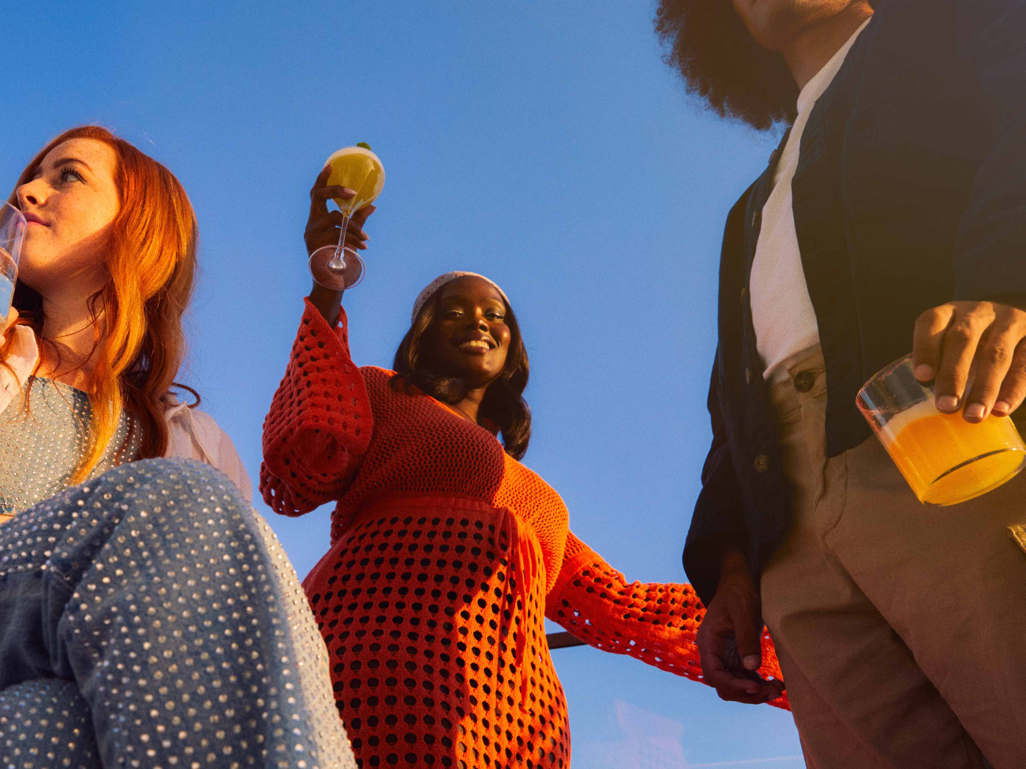 Hyde Friends Drinking and Dancing Under a Blue Sky