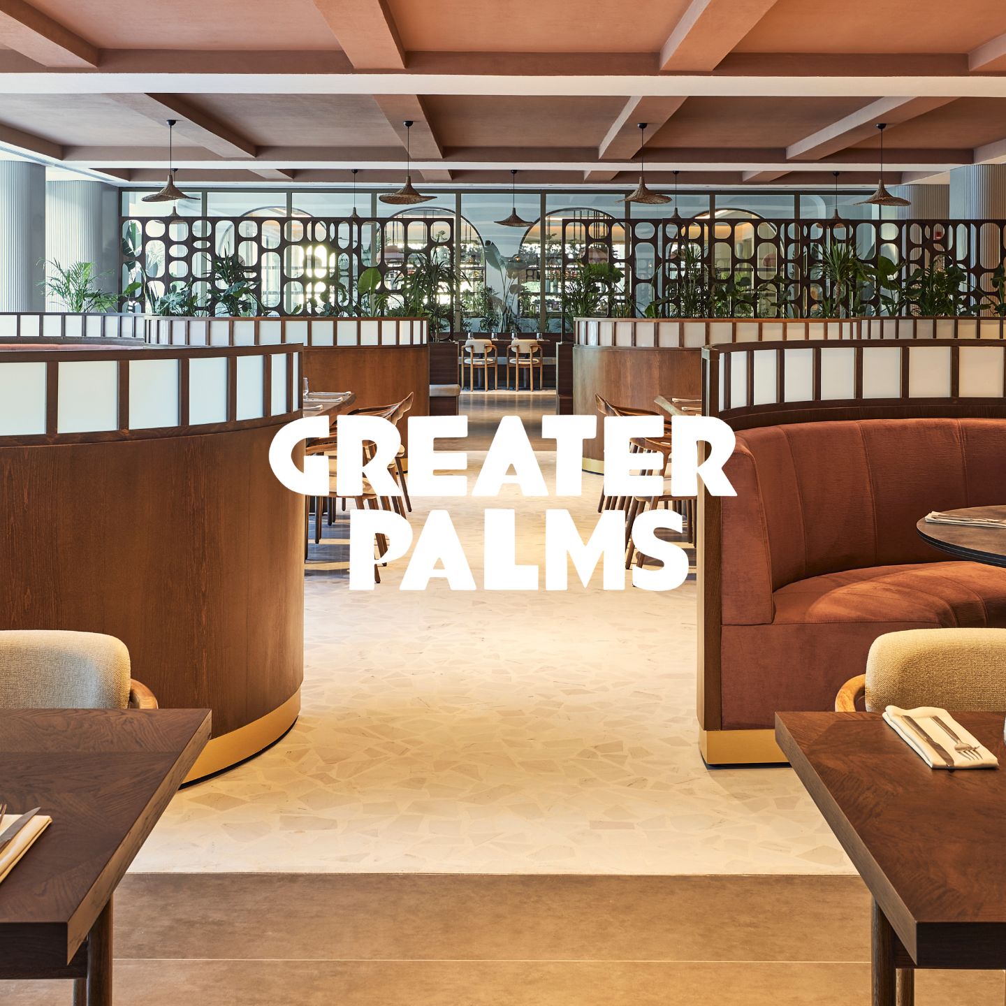 Large dining room with high-backed velvet booths and tables