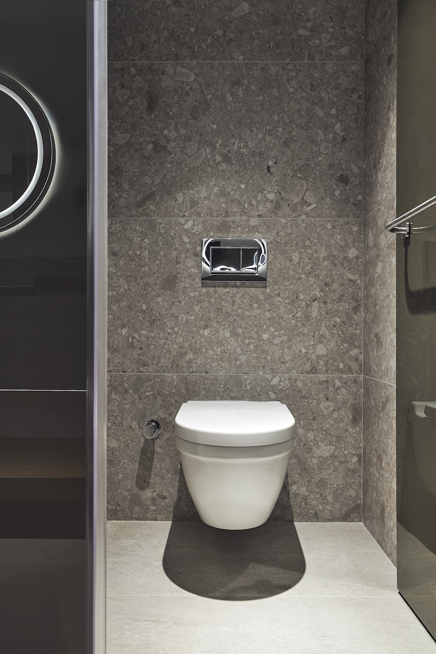 Grey bathroom with white toilet