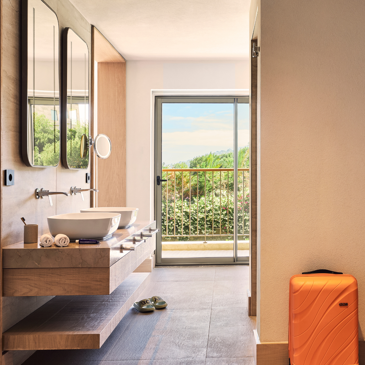 Modern and airy hotel bathroom with sea views