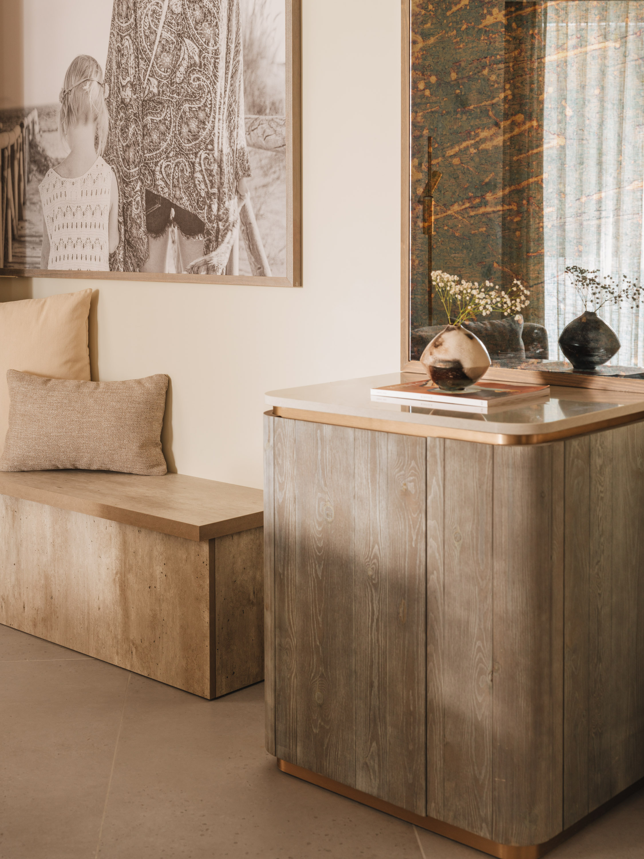 Seating area and table with artwork on the wall