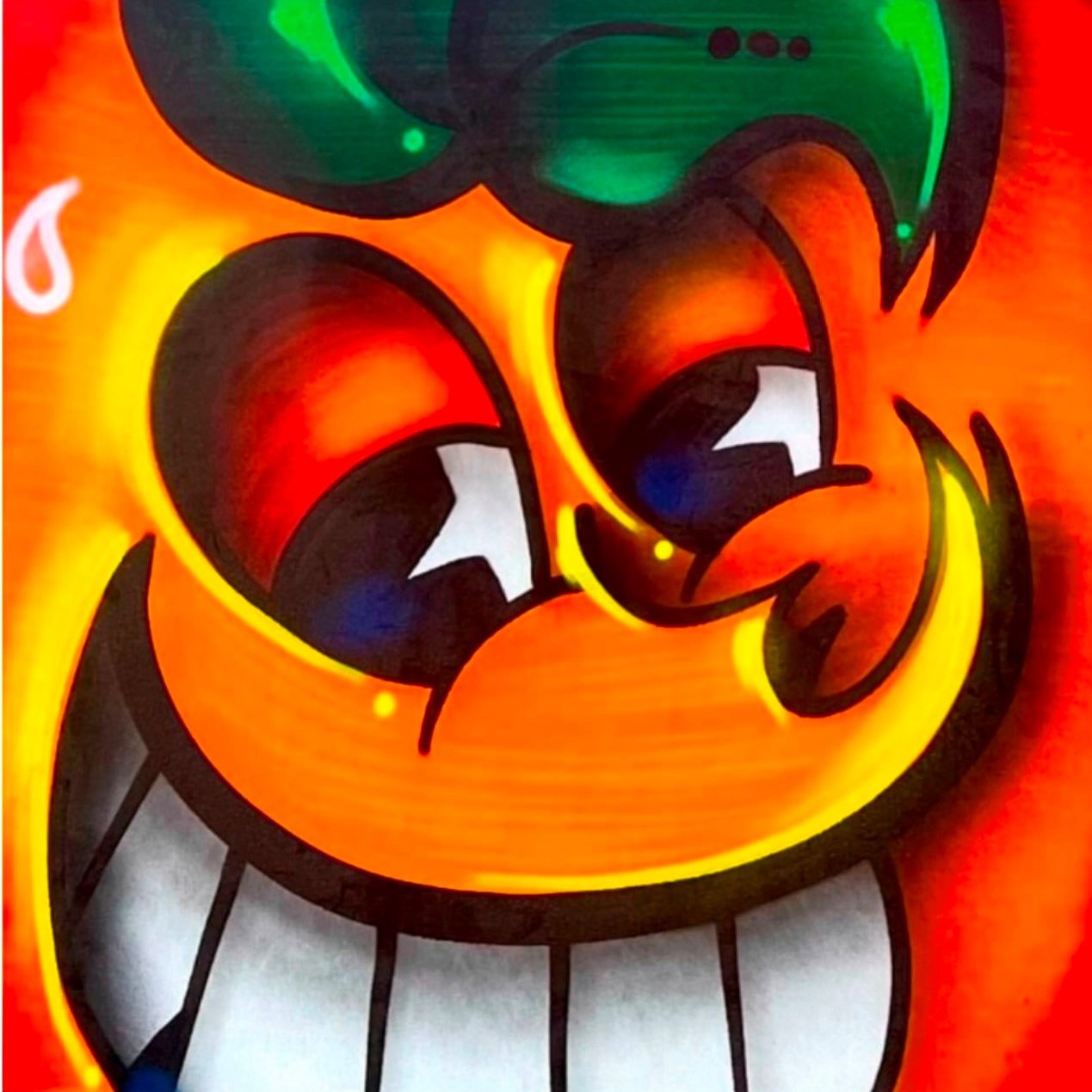 Orange piece of art of large smiling face