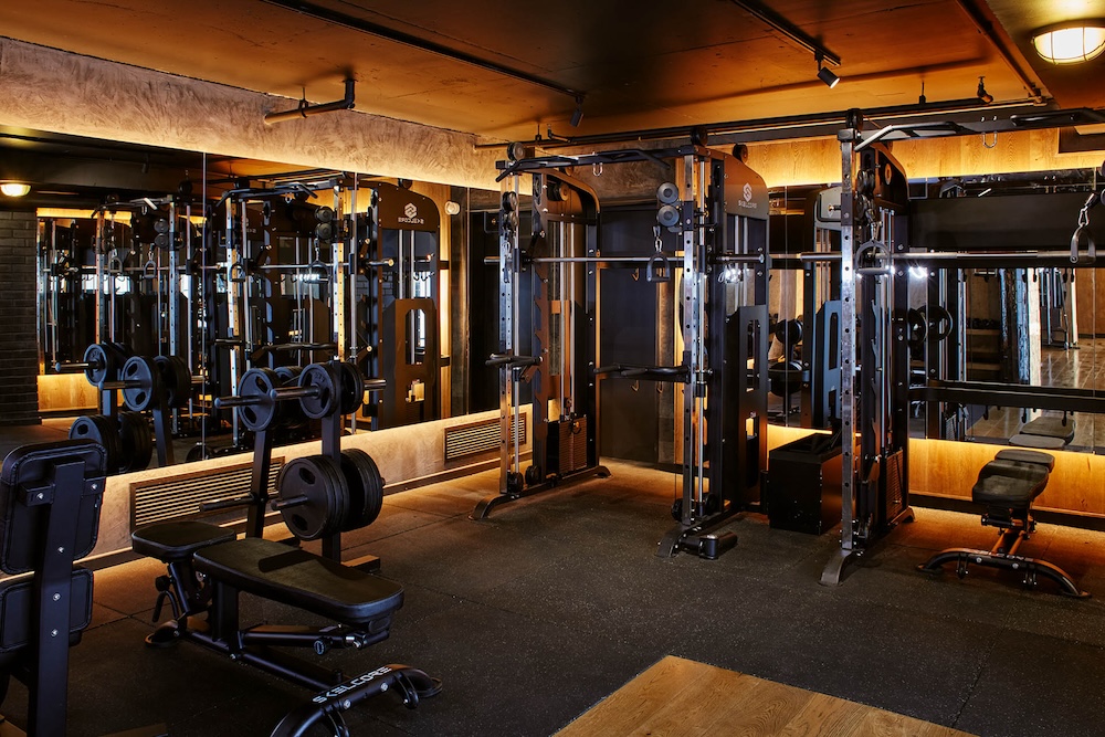 The strength section, with a smith machine at the back and a weight rack to the left of the image.